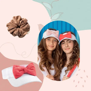 Two girls wearing Halo Luxe visors, product images of a terry visor & mocha terry scrunchie on right, promoting Resort Collection on a peach banner